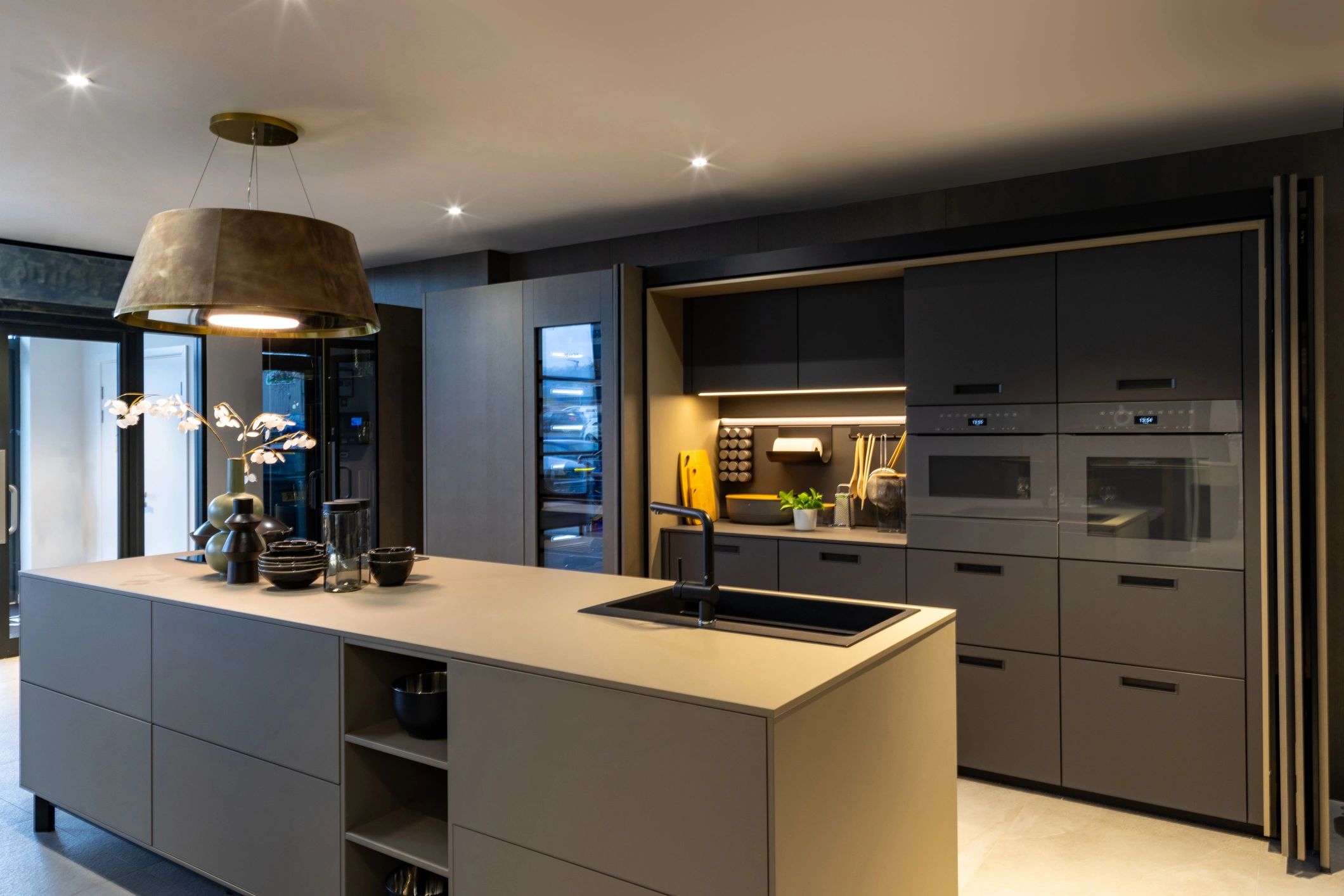 Modern interior fitout with dark cabinetry and marble island